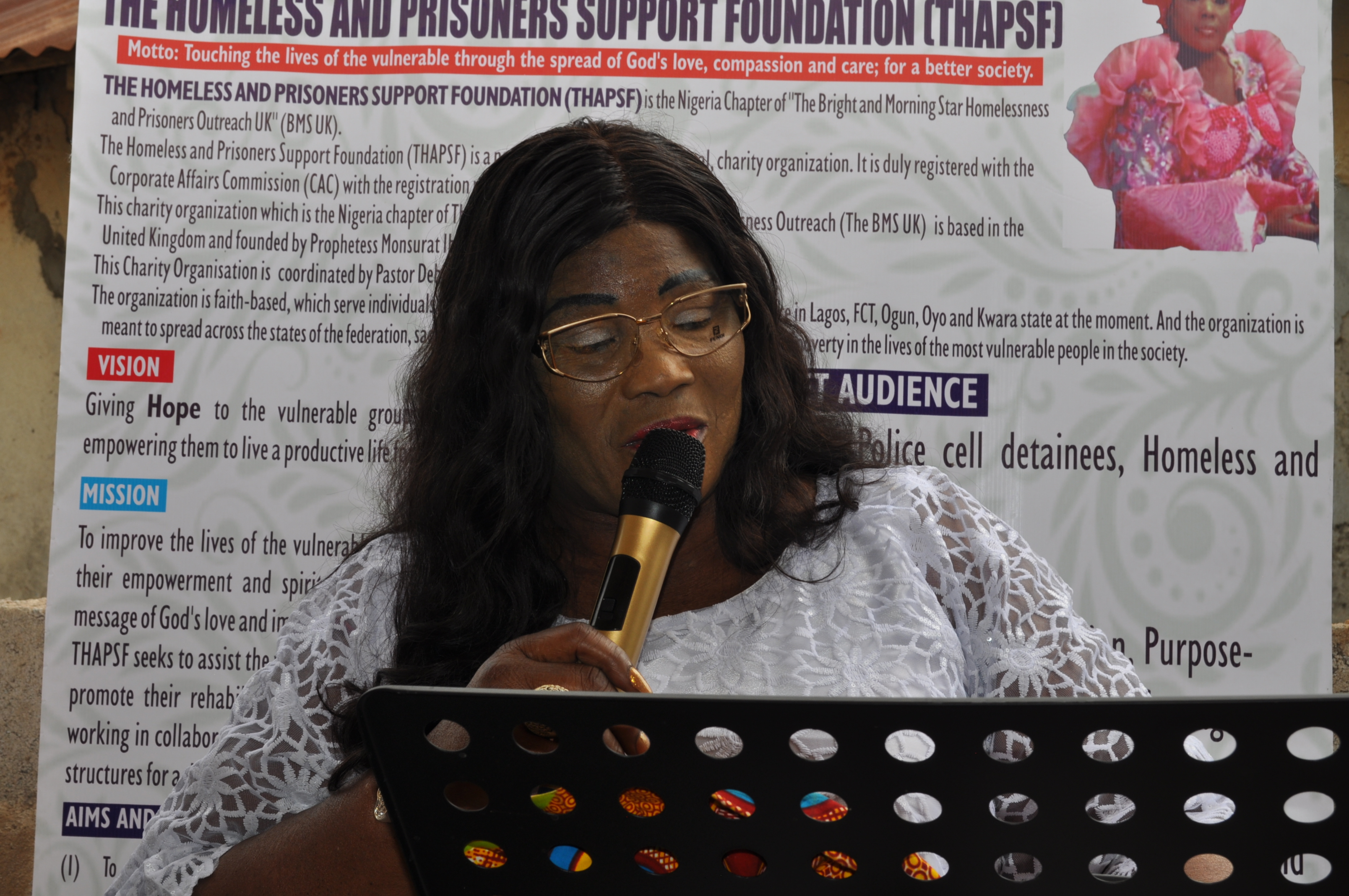 Zamani Community Speaker with Foundation Banner